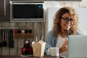 Person Eating While Attending Virtual Happy Hour