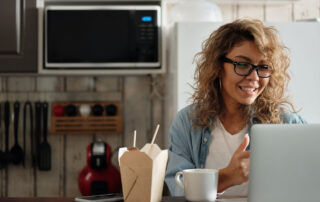 Person Eating While Attending Virtual Happy Hour